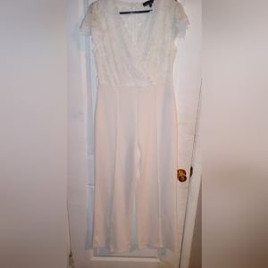 White pants suit beautiful lace at the top and zip zipper in the back size XL